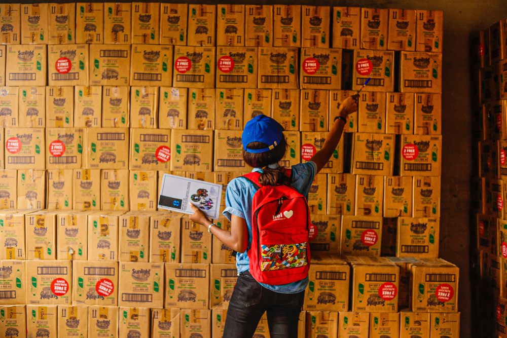 woman checking inventory in warehouse